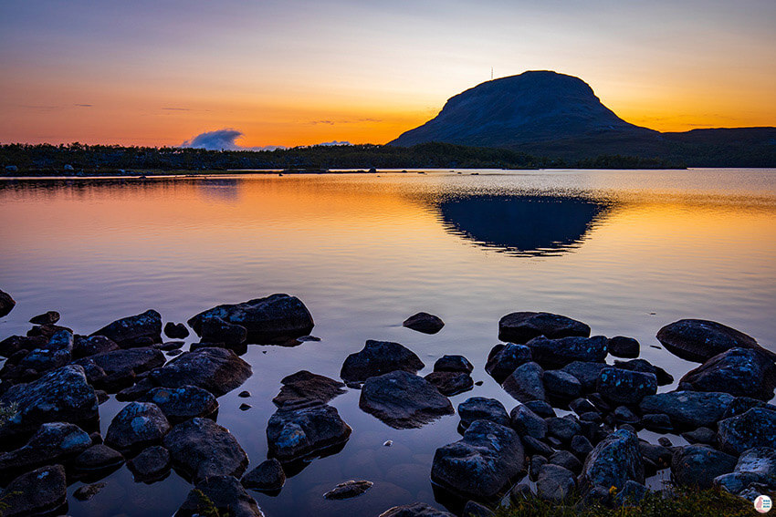 Sunset view of Saana Fell, over lake Tsahkaljärvi, Finland