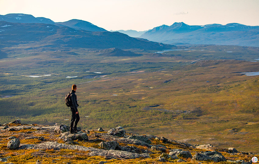 Man admiring the view on Saana hiking trail, Kilpisjärvi, Lapland, Finland