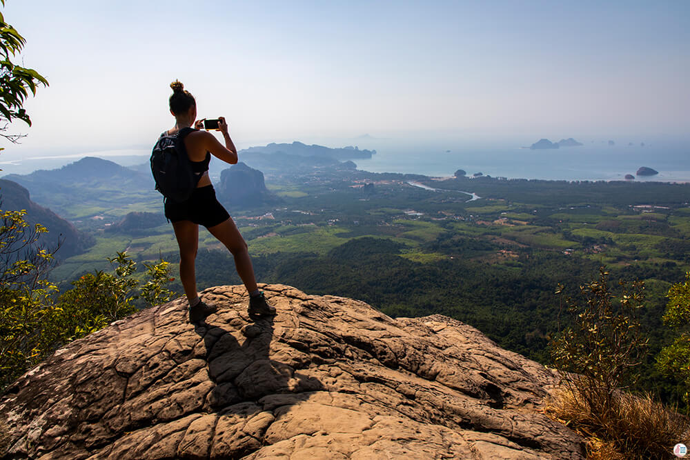 Woman taking picture at Khao Ngon Nak, (aka Dragon Crest), Krabi, Thailand